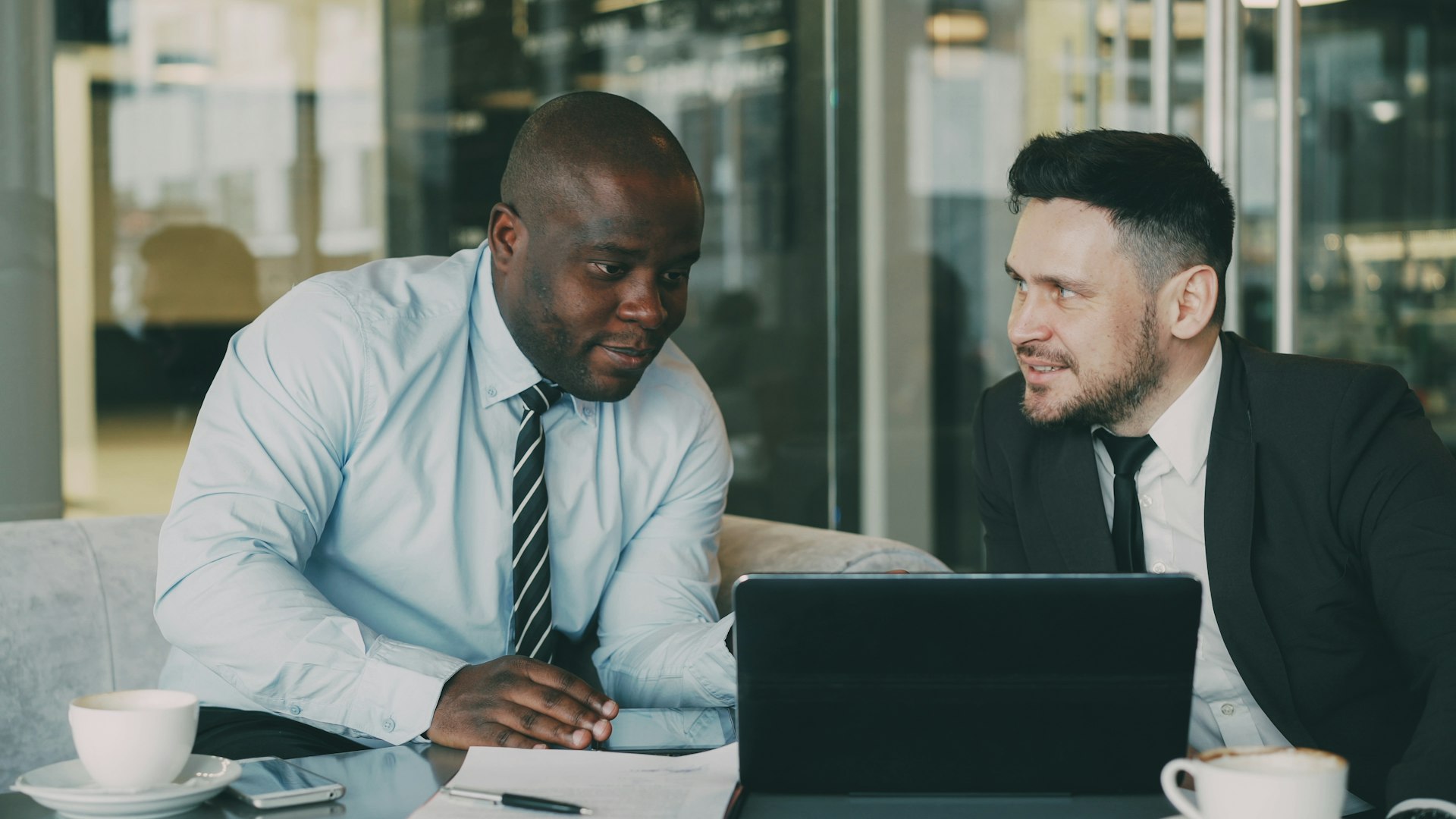 Tax advisor reviewing GST filing documents with a client