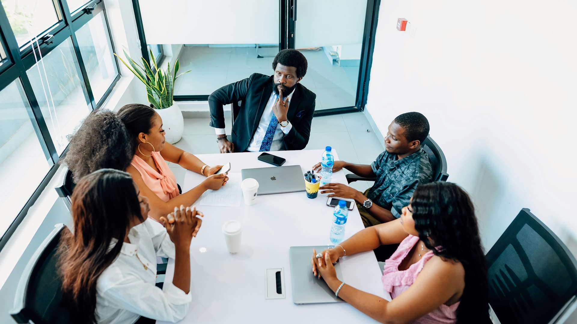 Entrepreneurs signing company registration paperwork