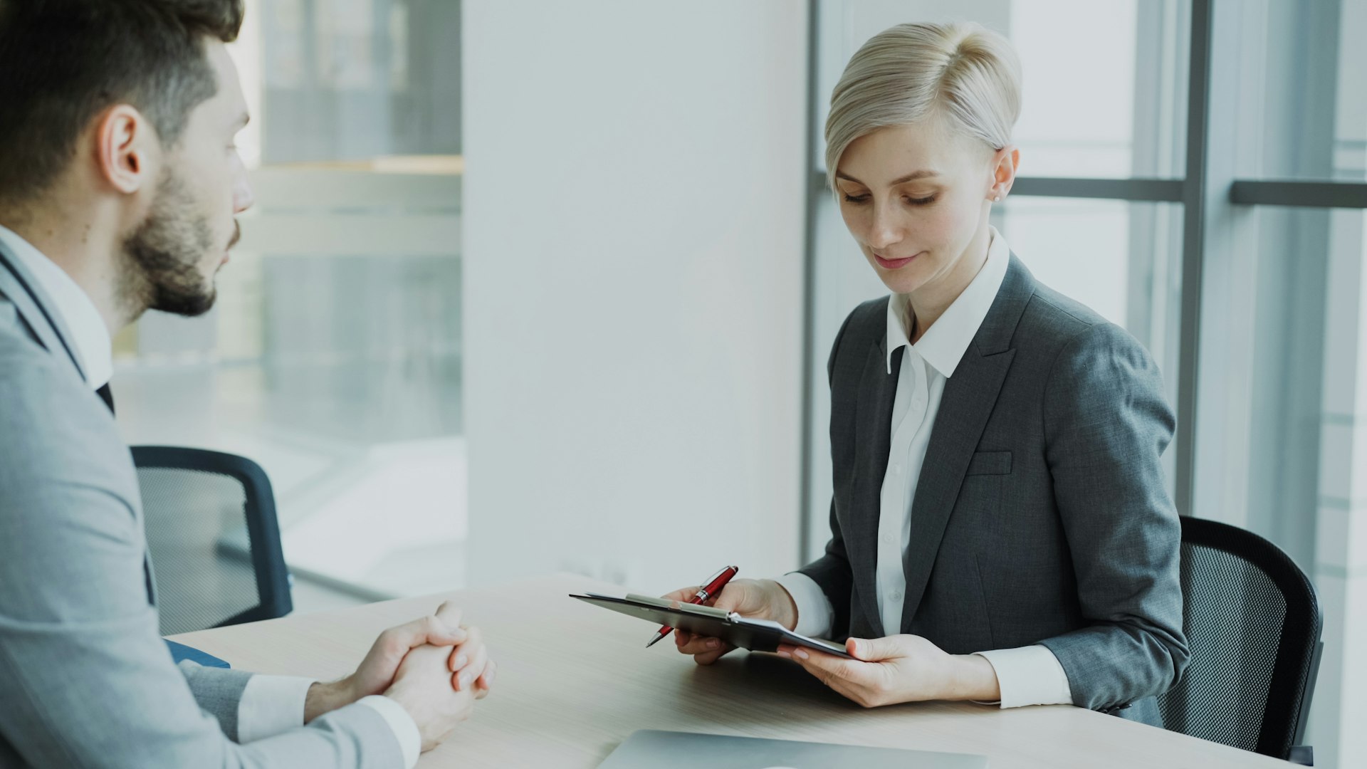 HR manager processing payroll on a computer